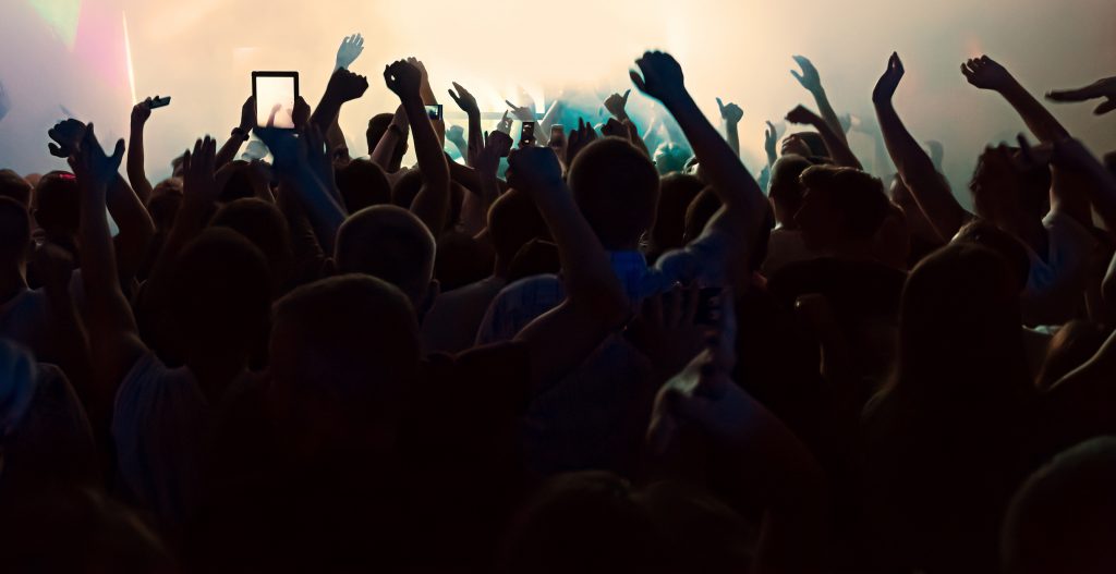 potential business audience at a concert